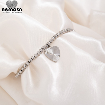 RadiantHeart™ – Textured Heart Pendant in 18K Gold & Silver Finish