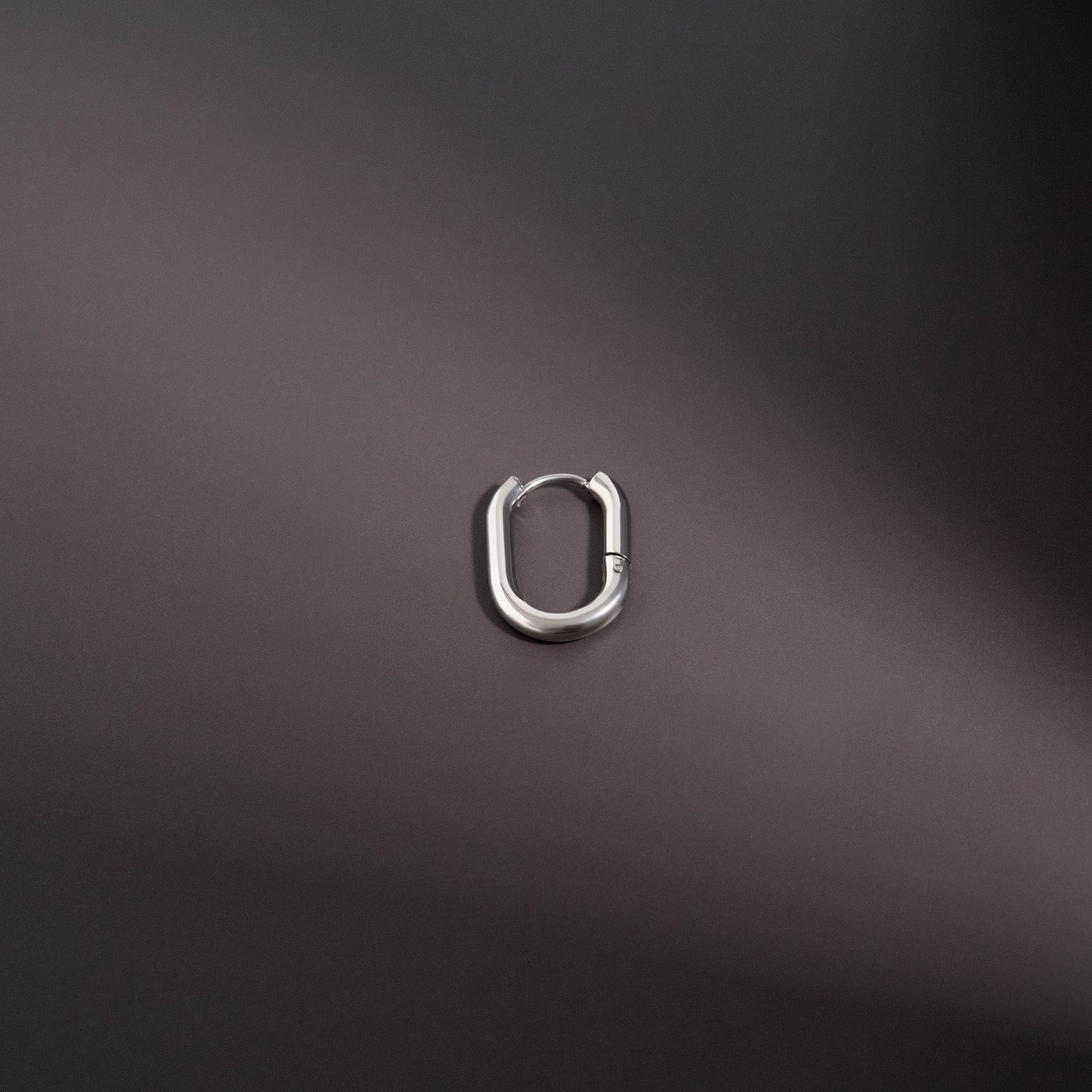 Closeup of NEMOSN FormaLink Silver Oval Hoop Earrings