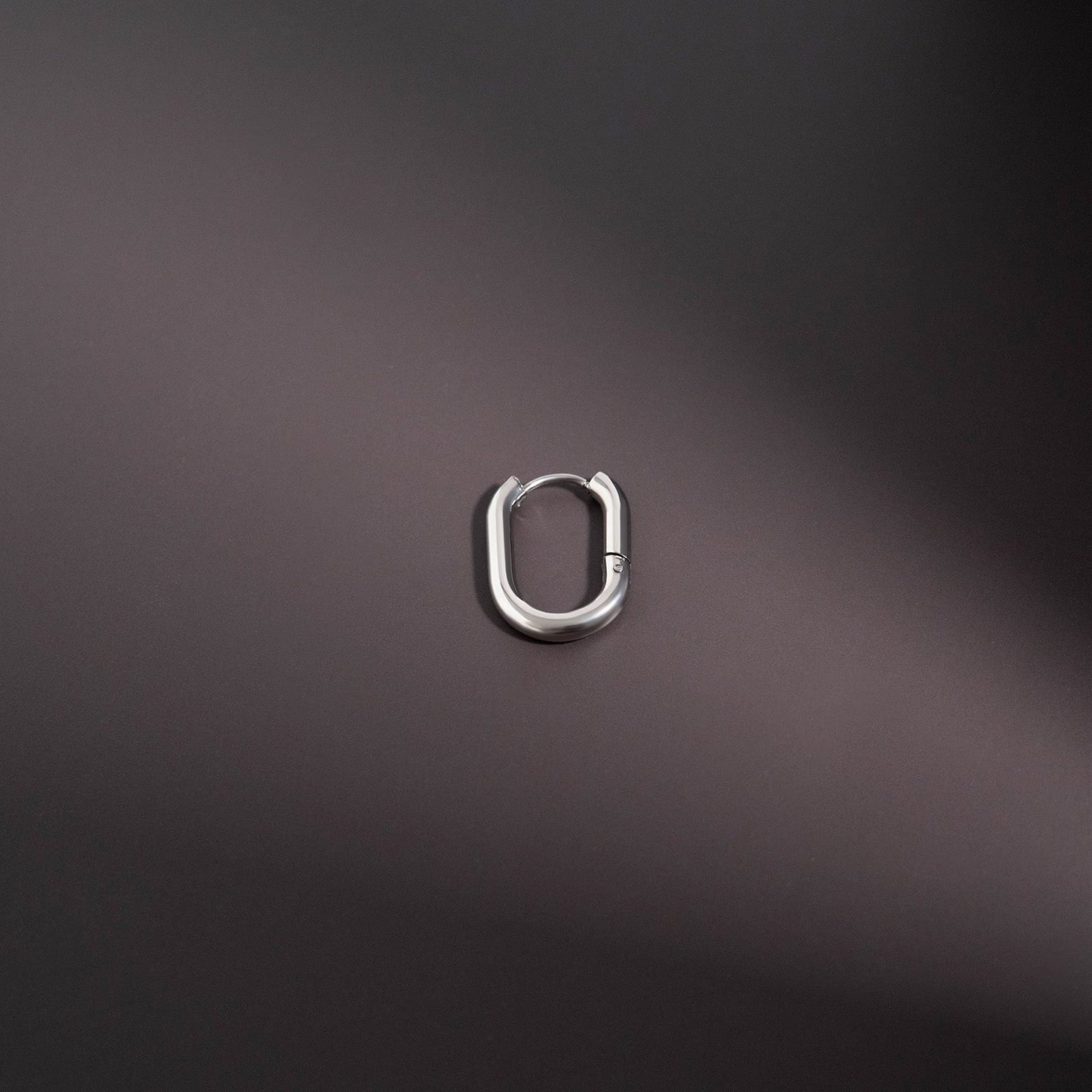 Closeup of NEMOSN FormaLink Silver Oval Hoop Earrings