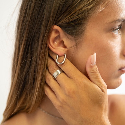Closeup of NEMOSN FormaLink Silver Oval Hoop Earrings
